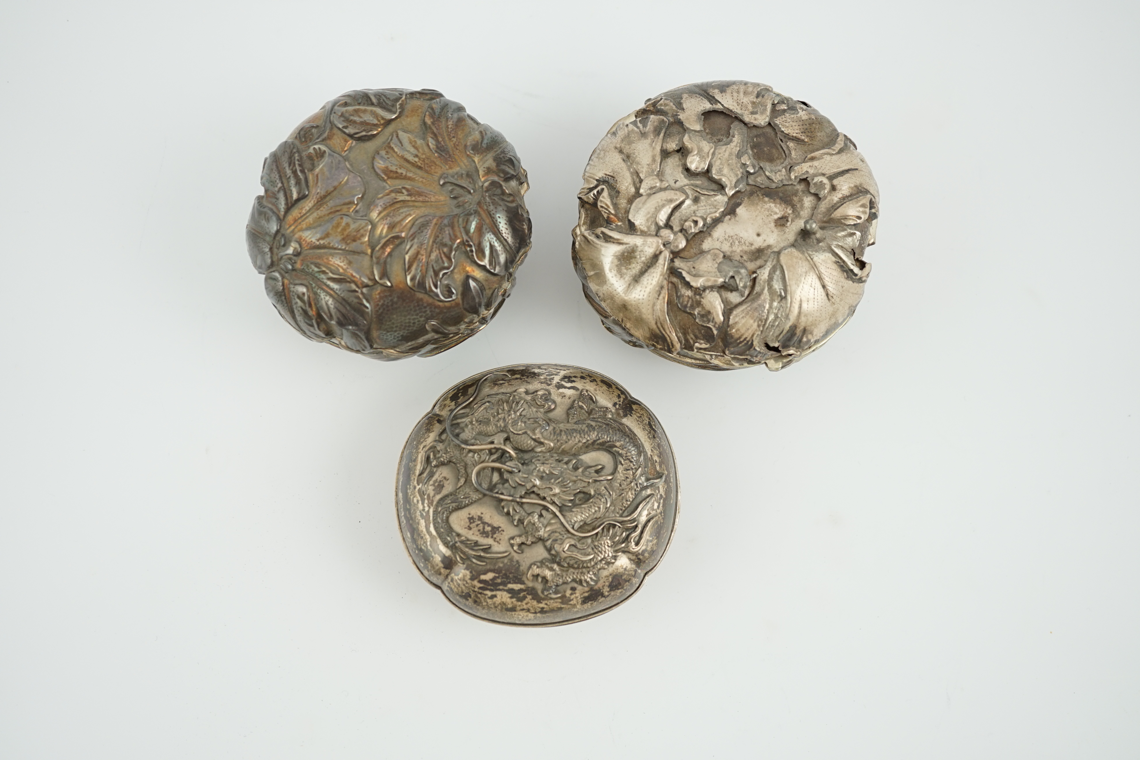 Three assorted early 20th century Japanese silver boxes with covers